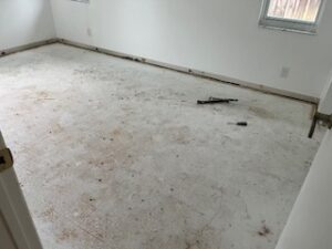 Flooring installation project, Delray Beach, Florida after carpet removal with exposed floor preparation